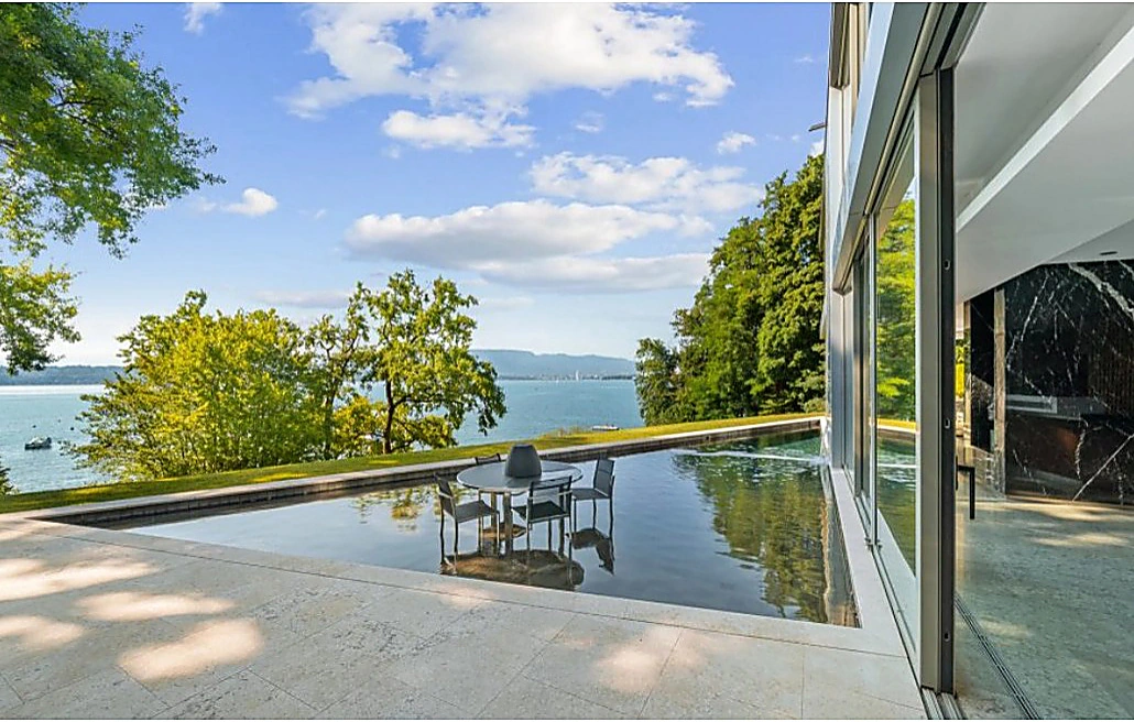 Contemporary Genthod residence with a terrace directly beside Lake Geneva